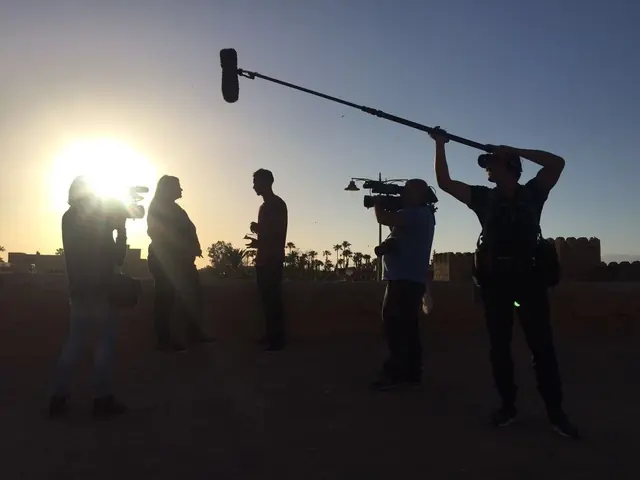 Lemuel Ruiz booming a sunset exterior with the camera crew