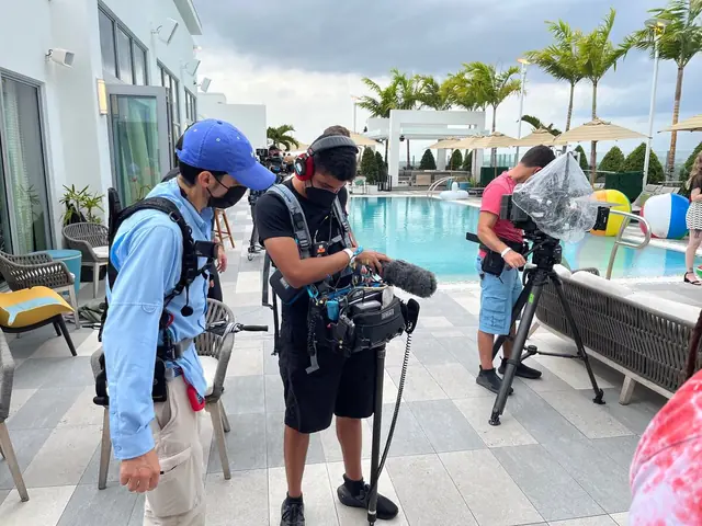 Max Rivera recording poolside on a South Florida shoot